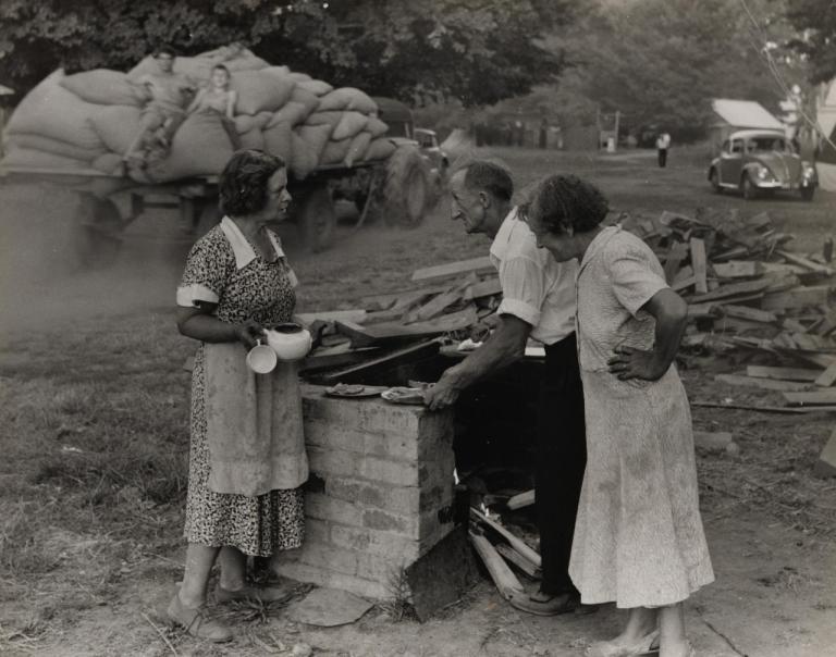 No title (Woman with a teapot talking to man and woman) (1957) from The hop pickers, Rostrevor, Ovens Valley, Victoria series 1957