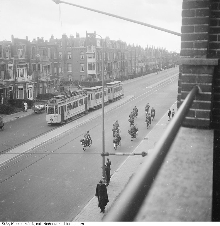 abandoned-german-soldiers-with-a-full-load-cycling-hague-on-mad-tuesday-september-5-1944