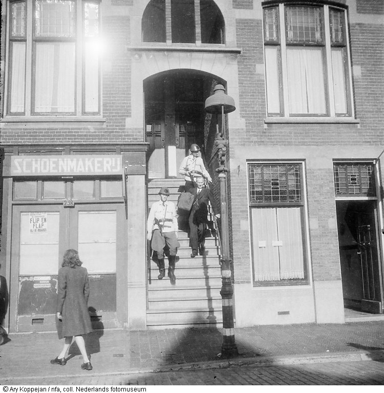 nazi-minded-man-is-taken-out-of-a-house-by-members-of-the-nbs-the-hague