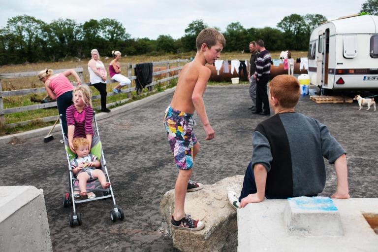 a-family-is-gathered-at-a-camp-on-the-backroads-of-county-carlow