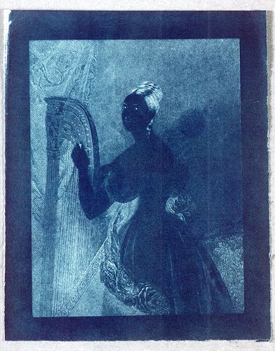 John Herschel An experimental cyanotype of an engraving of a lady with a harp 1842