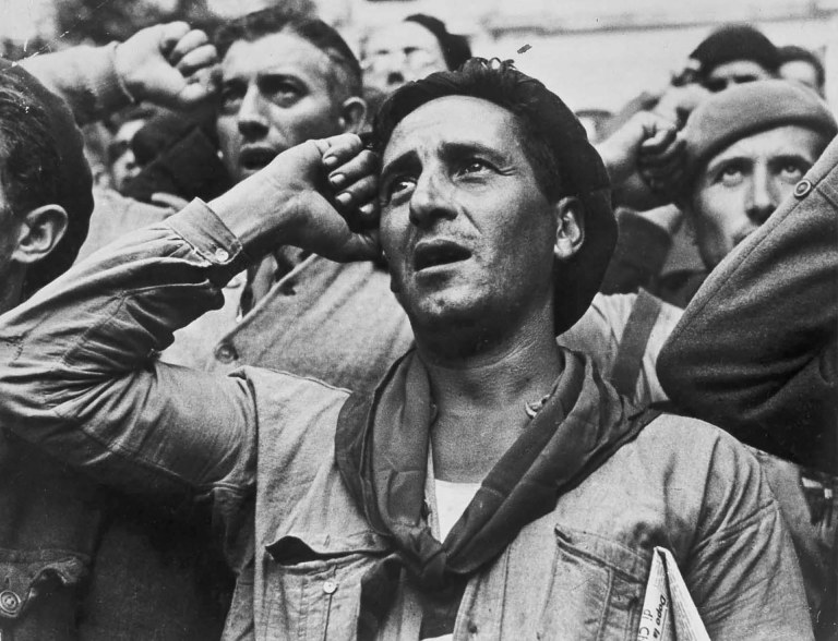 Robert Capa © International Center of Photography Bidding farewell to the International Brigades, which were dismissed by the Republican government, as a consequence of Stalin's friendship with Germany. Montblanc, near Barcelona, Spain. October 25th, 1938.