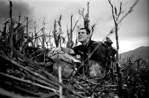 Corpsman Vernon Wike, 2:3rd Marine, looks in anguish when he realizes that his buddy is dead. Battle for Hill 881. 1967