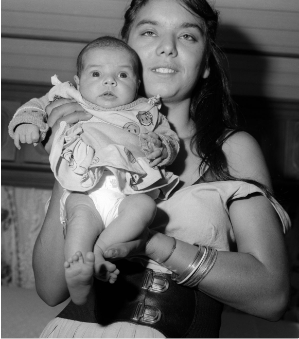 Gypsy woman with baby in arms, Western Harbor, Amsterdam (1989)