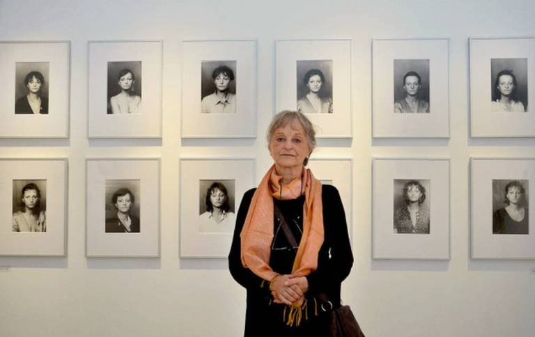 Germen photographer Helga Paris poses in front of her work displayed atDurbar Hall Art Gallery in