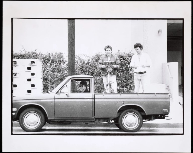 Danny Kwan, left, Ed Ruscha and Bryan Heath in Ruscha’s Datsun pickup truck in a 1975 image from the artist’s “Streets of Los Angeles” archive. (Ed Ruscha : Getty Research Institute)