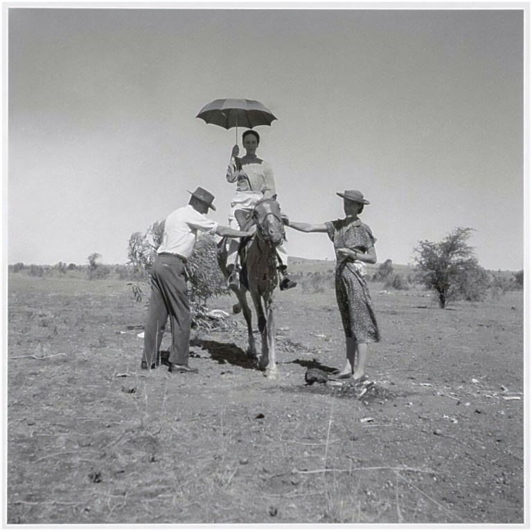 Cynthia Nolan mounted on the saddled dry carcass of a horse
